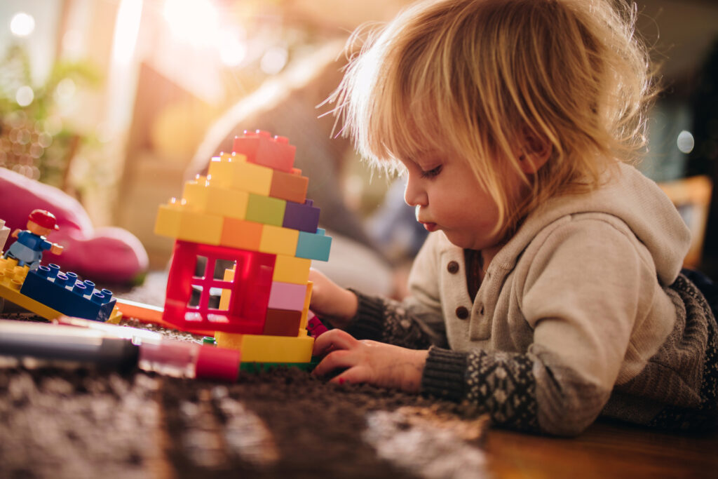 A child playing with blocks alone